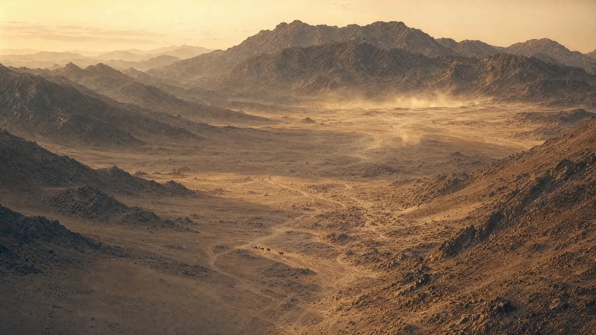 Wide desert valley under a hazy amber sky